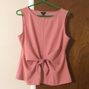 Rose color sleeveless blouse with a bow